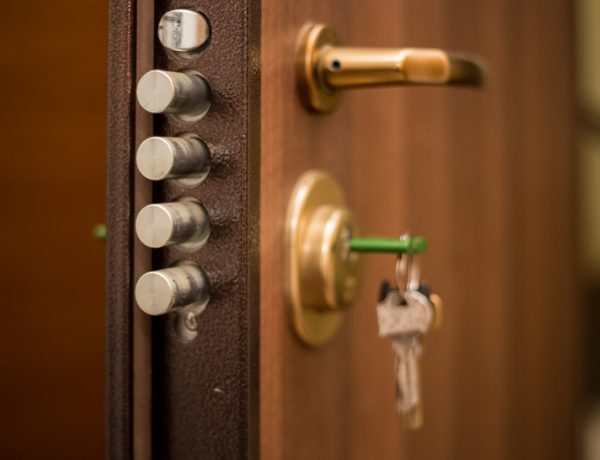 The keys in the lock of the door, on the outside, safety, locked doors, security, privacy